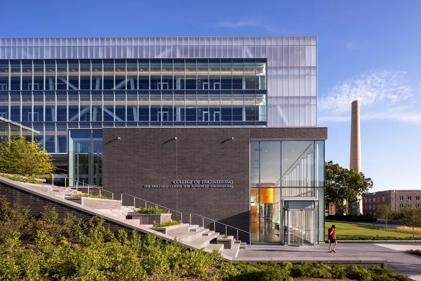 Exterior of the Fascitelli Center for Advanced Engineering at URI, with its glass facade and landscaped entry steps